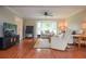 Cozy living room with hardwood floors, a bay window, and neutral-toned furniture, creating a relaxing atmosphere at 830 Montego Sw Way, Lilburn, GA 30047