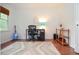 Office with a blue guitar, desk and a window at 830 Montego Sw Way, Lilburn, GA 30047