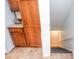 View of the staircase with adjacent storage cabinets offering a practical design and extra space at 830 Montego Sw Way, Lilburn, GA 30047