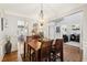 Dining room features hardwood floors and a chandelier at 2720 Lansing Ln, Cumming, GA 30041