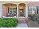 Inviting front porch with brick steps and wicker chairs at 2720 Lansing Ln, Cumming, GA 30041