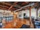 Open living area with exposed beams, hardwood floors, and city views at 490 Marietta St # 307, Atlanta, GA 30313