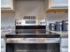 Stainless steel range with modern glass cooktop at 537 Daffodil Ln, Mcdonough, GA 30253