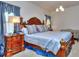 Large bedroom with king-size bed and ornate wooden furniture at 537 Daffodil Ln, Mcdonough, GA 30253