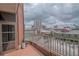 Balcony with brick flooring, metal railing, and city views at 250 Park Avenue West Nw # 903, Atlanta, GA 30313