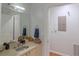 Light bathroom with a stone countertop and a large mirror at 250 Park Avenue West Nw # 903, Atlanta, GA 30313