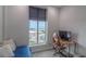 Cozy bedroom with a large window and desk space at 250 Park Avenue West Nw # 903, Atlanta, GA 30313