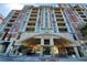 Upscale multi-story building featuring a covered entrance and multiple balconies for luxurious living at 250 Park Avenue West Nw # 903, Atlanta, GA 30313