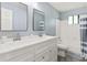 Bathroom with double vanity, shower/tub combo and gray floor at 2685 Mars Hill Church Nw Rd, Acworth, GA 30101