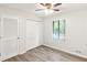 Bright bedroom with double door closet and wood-look floors at 2685 Mars Hill Church Nw Rd, Acworth, GA 30101