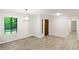 Bright dining room with wood-look floors and an adjacent entryway at 2685 Mars Hill Church Nw Rd, Acworth, GA 30101