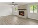 Living room with fireplace, shiplap walls, and wood-look floors at 2685 Mars Hill Church Nw Rd, Acworth, GA 30101