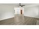 Open living area with wood-look floors, shiplap accent wall, and entryway at 2685 Mars Hill Church Nw Rd, Acworth, GA 30101