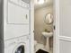 Small bathroom with pedestal sink and stackable washer/dryer at 771 Jordan Ln # F, Decatur, GA 30033