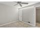 Simple bedroom with ceiling fan, window, and neutral walls at 771 Jordan Ln # F, Decatur, GA 30033