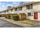 Brick townhouse with red door and a fenced yard at 771 Jordan Ln # F, Decatur, GA 30033