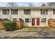 Brick townhouse with red doors and a fenced yard at 771 Jordan Ln # F, Decatur, GA 30033