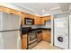 Modern kitchen with stainless steel appliances and wood cabinets at 771 Jordan Ln # F, Decatur, GA 30033