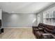 Living room with hardwood floors and large window at 771 Jordan Ln # F, Decatur, GA 30033