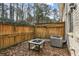 Private patio with fire pit and wooden fence at 771 Jordan Ln # F, Decatur, GA 30033