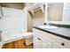 Clean bathroom with a shower/tub combo, vanity, and wood-look floors at 3 Bay St, Covington, GA 30014