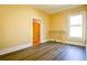 Simple bedroom with wood-look floors and neutral walls at 3 Bay St, Covington, GA 30014