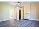 Spacious bedroom featuring hardwood floors, a fireplace, and built-in shelving at 3 Bay St, Covington, GA 30014