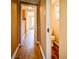 Long hallway with wood-look flooring, leading to other rooms at 3 Bay St, Covington, GA 30014