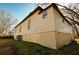 Side view of a tan house with a raised foundation at 3 Bay St, Covington, GA 30014