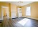 Bright living room featuring hardwood floors and fireplace at 3 Bay St, Covington, GA 30014