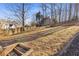 Large backyard with steps and a wooden fence at 610 Lovinggood Trl, Woodstock, GA 30189