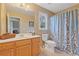 Clean bathroom with shower/tub combo and wood vanity at 610 Lovinggood Trl, Woodstock, GA 30189