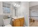 Bathroom with toilet and wood vanity at 610 Lovinggood Trl, Woodstock, GA 30189