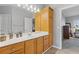 Bathroom with wood cabinets and a large mirror at 610 Lovinggood Trl, Woodstock, GA 30189