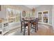 Bright breakfast nook with table and chairs near kitchen and sunroom access at 610 Lovinggood Trl, Woodstock, GA 30189