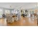 Bright dining room with a wooden table and comfortable seating near the kitchen at 610 Lovinggood Trl, Woodstock, GA 30189