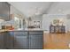 Spacious kitchen with granite countertops and island at 610 Lovinggood Trl, Woodstock, GA 30189