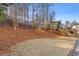 Landscaped area with pine straw and groundcover at 610 Lovinggood Trl, Woodstock, GA 30189