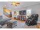 Relaxing living room with a massage chair and built-in shelving at 610 Lovinggood Trl, Woodstock, GA 30189