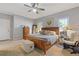 Main bedroom with wood furniture and carpeted floors at 610 Lovinggood Trl, Woodstock, GA 30189