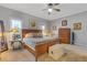 Main bedroom with wood furniture and carpeted floors at 610 Lovinggood Trl, Woodstock, GA 30189