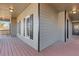 Side view of the house's porch with wooden flooring at 610 Lovinggood Trl, Woodstock, GA 30189