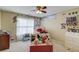 Bedroom featuring white window, collection of stuffed animals, and playful wall decor at 1095 Whitehawk Trl, Lawrenceville, GA 30043