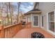 Wooden deck area with railing, offering views of a wooded backyard and outdoor space at 1095 Whitehawk Trl, Lawrenceville, GA 30043