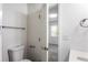 Bathroom features a white toilet, grey countertop, and a view into a bright bedroom at 1380 Westmont Sw Rd, Atlanta, GA 30311