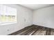 Bright bedroom featuring hardwood floors, fresh white walls, and a new window at 1380 Westmont Sw Rd, Atlanta, GA 30311