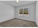 Well-lit bedroom with carpeted floors and a window at 4131 Fulson Dr, Lilburn, GA 30047