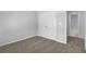 Bright bedroom with double doors and access to a full bath at 4131 Fulson Dr, Lilburn, GA 30047