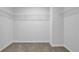 Walk-in closet with wire shelving and carpeted floor at 4131 Fulson Dr, Lilburn, GA 30047