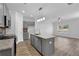 Modern kitchen with gray cabinets, granite countertops and island at 4131 Fulson Dr, Lilburn, GA 30047